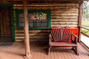 Porch at Hat Ranch with chair and flowers