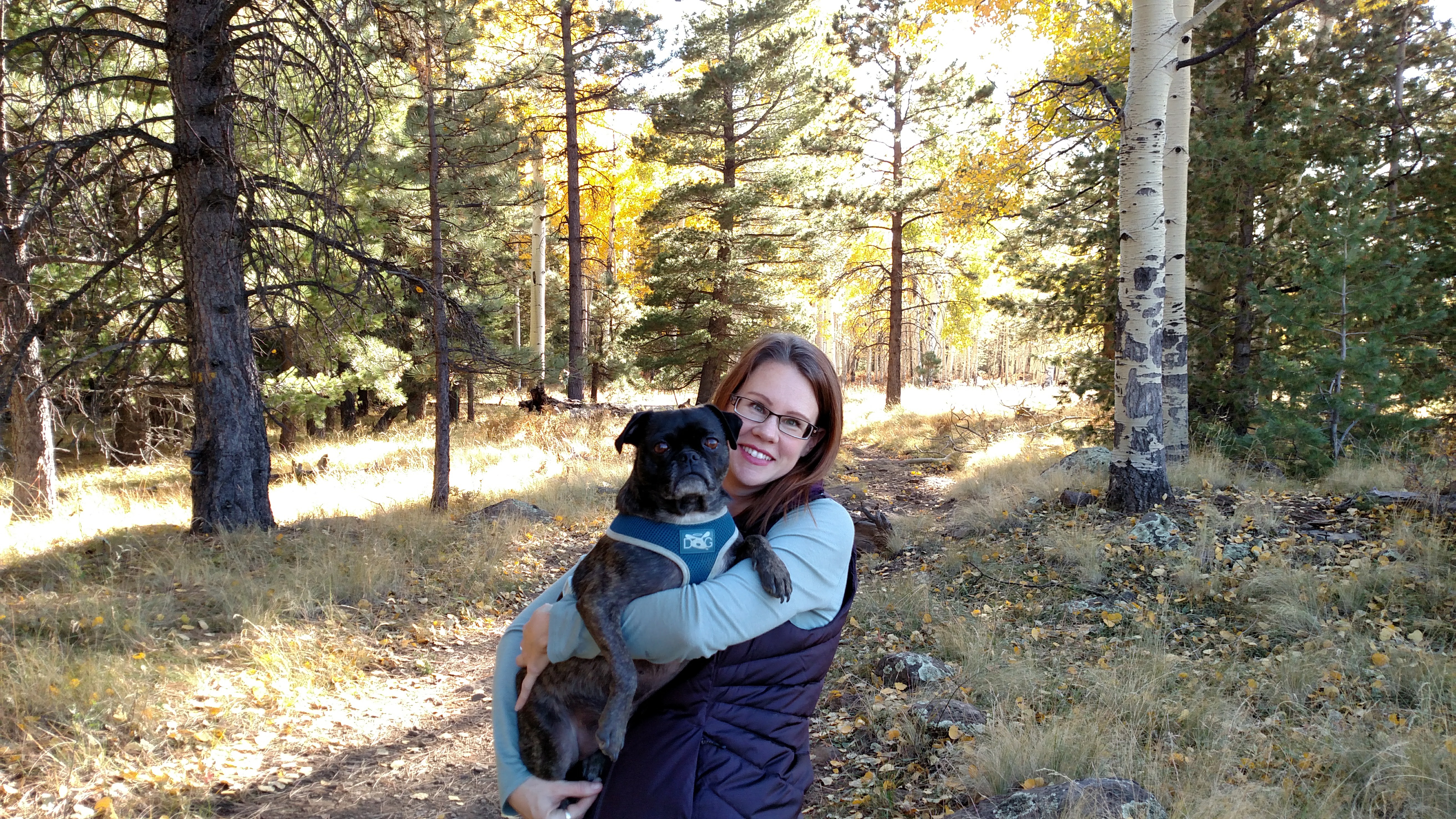 Audra Travelbee in the woods with her dog, Miyagi