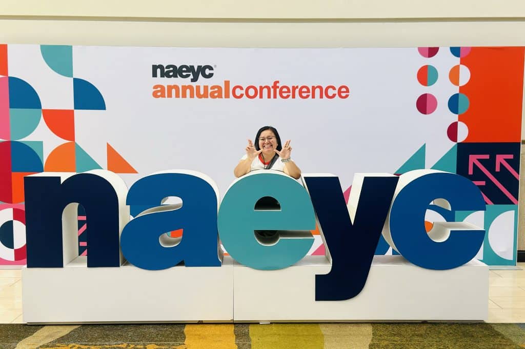 Linda Begaye with an NAEYC sign