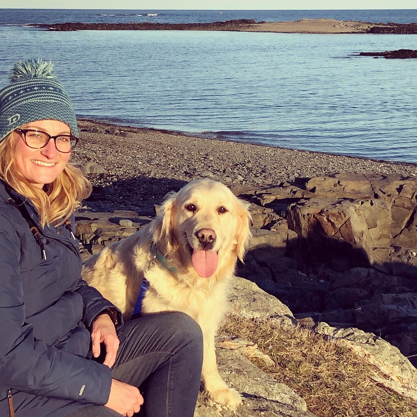 Whitney McKay and her dog by a lake