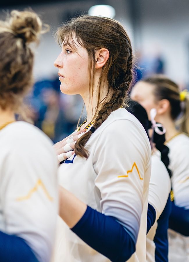 Grace Greenlee on the side of the volleyball court
