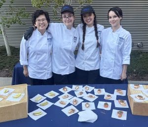 HRM students in front of food display