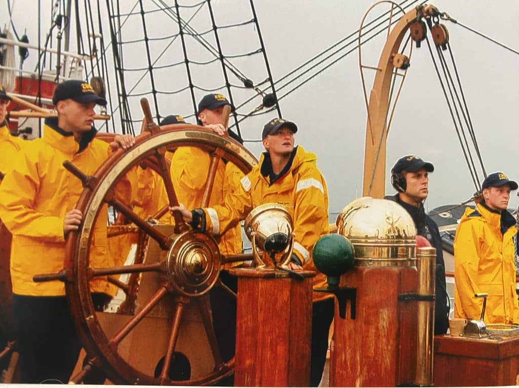 Whitney McKay, center, on a Coast Guard ship