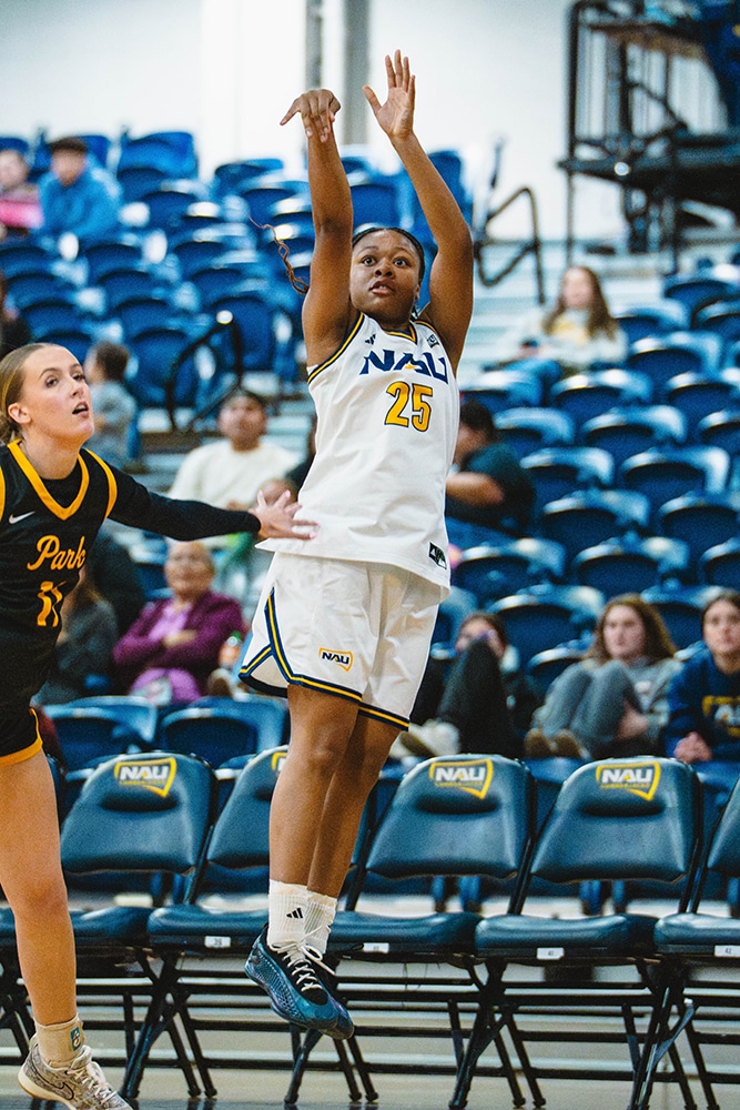 Naomi White shooting a basketball