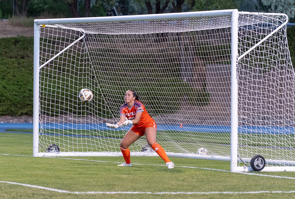 Reece Reichwald in goal catching a soccer bal