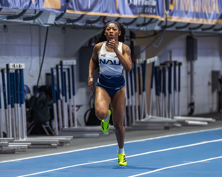 Shanye Harris running on a blue track