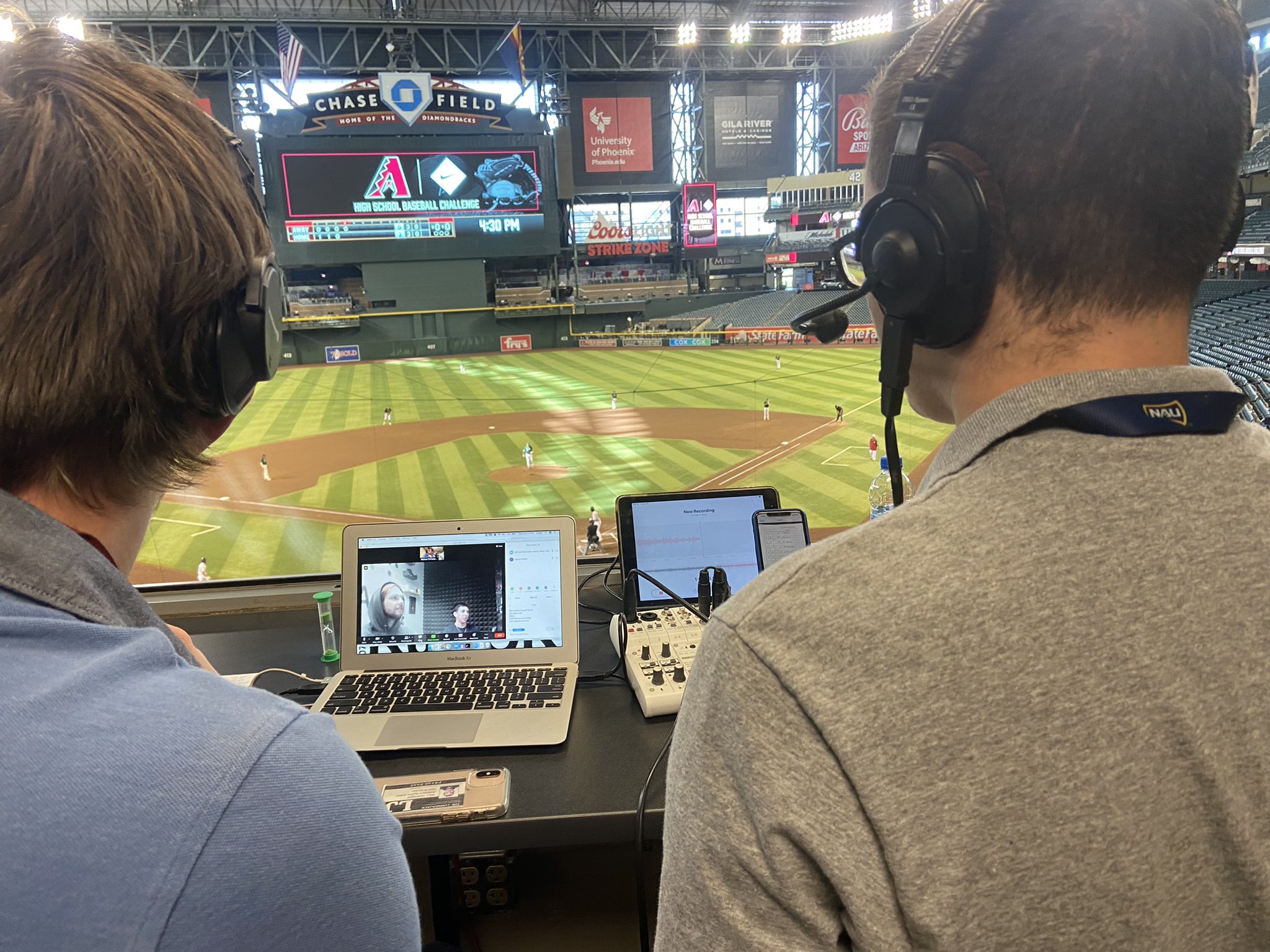 Two students reporting during a game