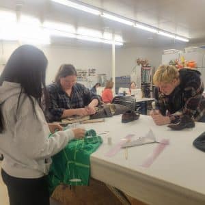 Costume crew altering costumes. NAU Theater