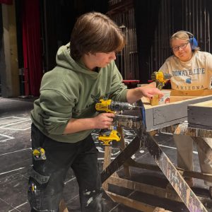 Theater students working on building the stage