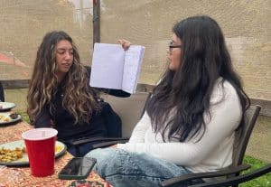 Natalia Canaan and Samantha Marin Olmos doing a presentation