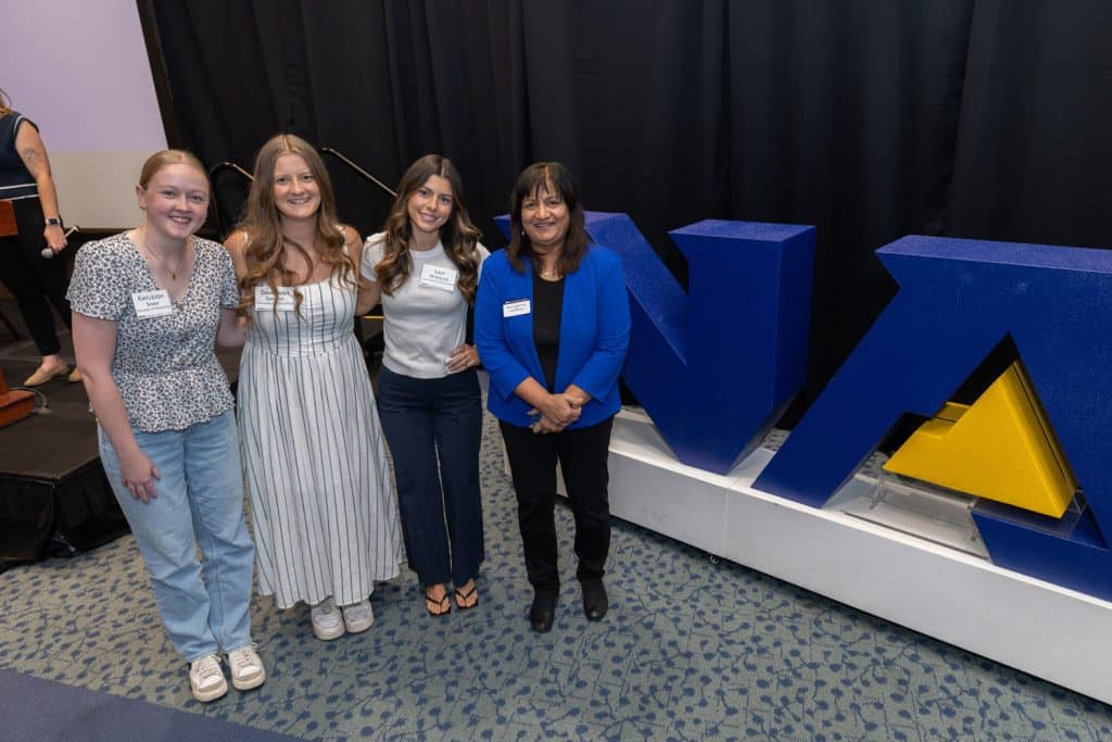 Ramona Mellott with students at an NAU event