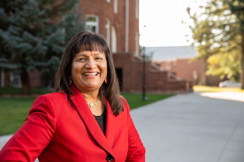 Headshot of Ramona Mellott in a red blazer outside on the NAU campus
