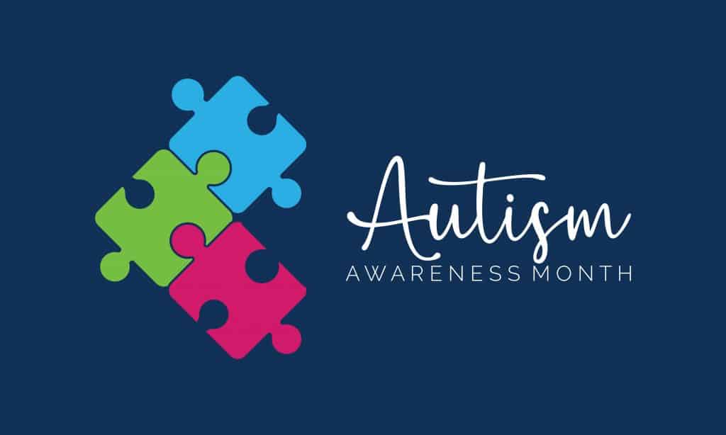Three puzzle pieces, one blue, one green and one red, locked together. Autism Awareness Month spelled next to them.