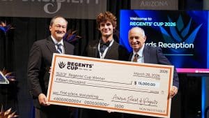 Benjamin Winkler and two men holding a giant check